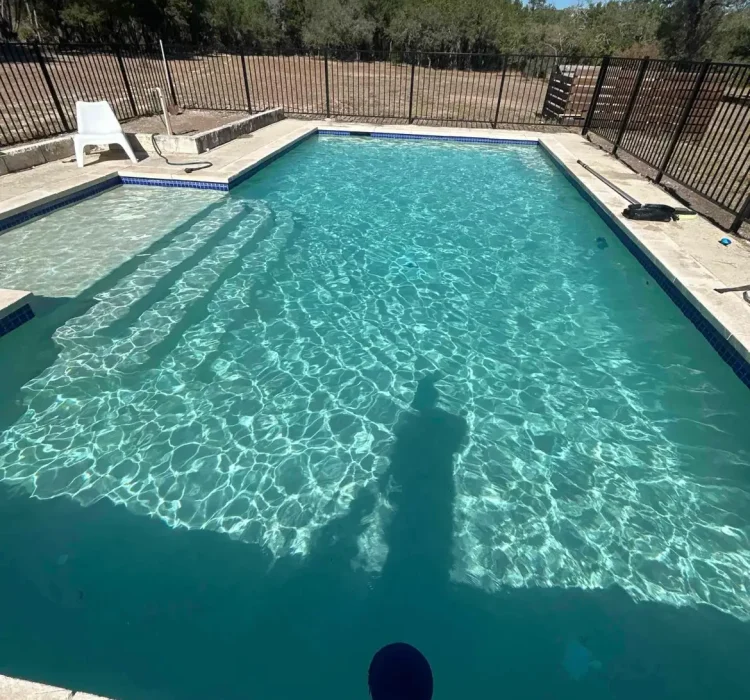 Calcium scale removed from waterline tile at a West Palm Beach pool